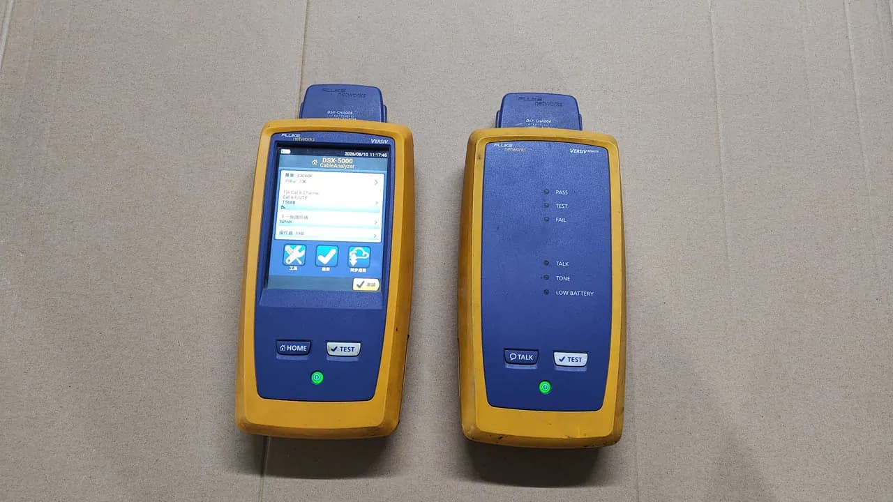 Two cable certifiers on a workbench in the quality-control room