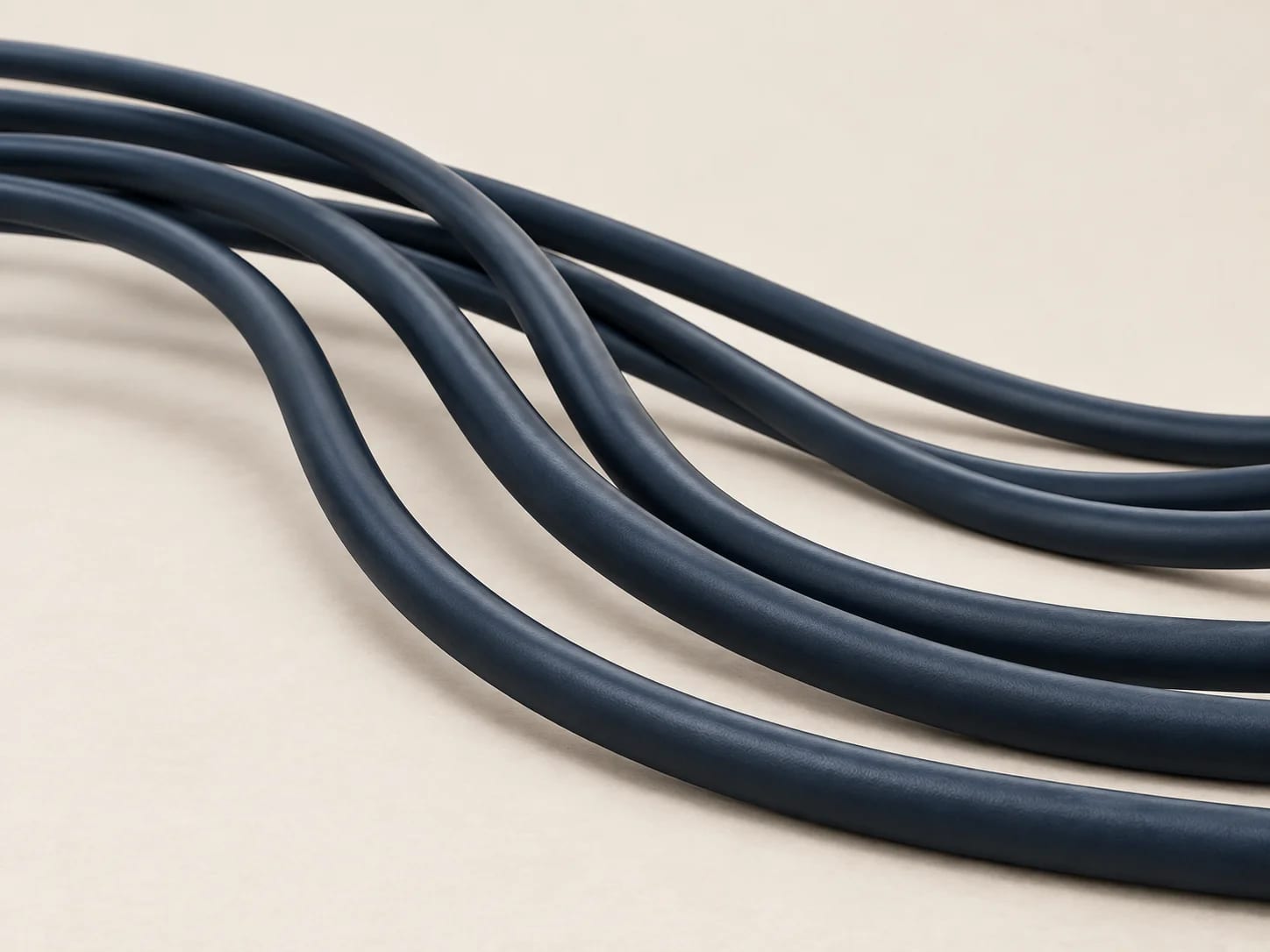 Several dark-jacketed network cables curving in parallel across the frame. Orientation image; verified values are on each product record.